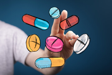 Hand interacting with vibrant drawn pills and capsules.  Medical, healthcare, pharmacy concept.