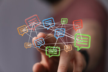 Abstract concept of social network, communication, and technology illustrated by a hand interacting with speech bubbles and connected nodes.