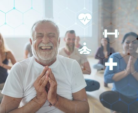 Smiling old man in yoga class