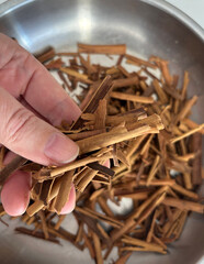 Broken Ceylon Cinnamon Textured Background, Cinnamomum Verum Bark Pieces Pattern