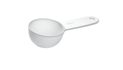 White plastic scoop, handle with hole, tilted at angle against solid black background