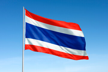 Waving Thailand flag, national symbol, blue sky
