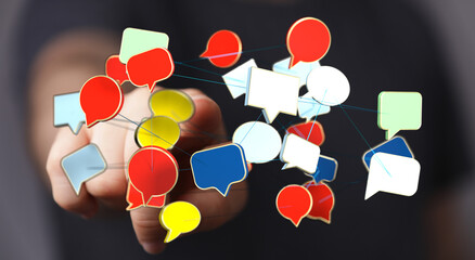 A hand reaching towards floating, colorful speech bubbles, representing communication, connection,...