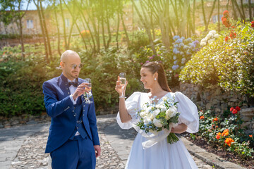 Newlywed couple stepping out of the car and entering the beautiful villa for their special day event