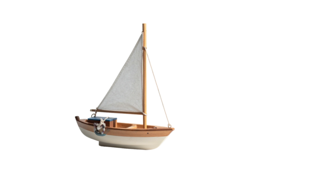 Wooden toy sailboat with a white sail against a solid black background