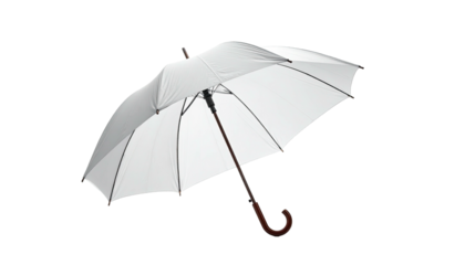 A pristine, open white umbrella with a wooden handle against a stark black background