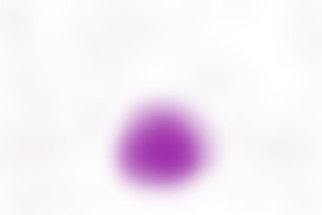 Abstract close up of a blurred purple droplet shape against a dark out of focus background with subtle textures