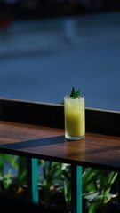 Passion fruit juice in a glass on a table in a cafe