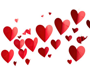 Red paper hearts scattered on black