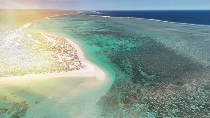 Panoramic aerial view of Turquoise Bay in WA with reef, waves, and tropical scenery
