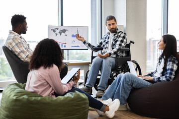 Young diverse professionals collaborating on financial analysis with visible teamwork and inclusion