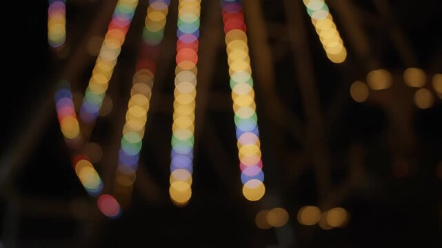 Ferris Wheel at Night With Colorful Blurred Lights in Motion at a Local Carnival or State Fair
