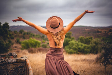 Woman enjoying freedom in Algarve nature landscape