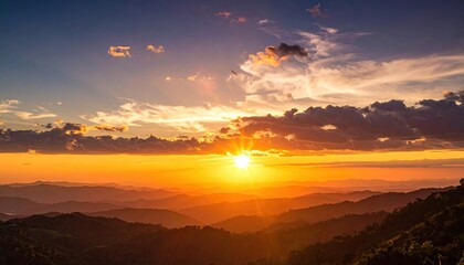 Radiant Golden Sunset Over Mountainous Horizon With Dramatic Sky Clouds And Sunlight