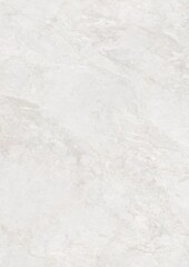 Close-up of a smooth, light gray marble surface with subtle veining patterns.