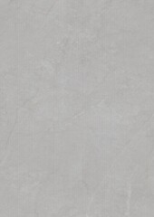 Close-up of a textured gray surface with subtle variations in tone and faint markings