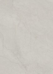 Close-up of a textured gray surface with subtle cracks and creases