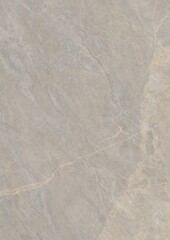 Aerial view of arid terrain with dry riverbeds and sparse vegetation