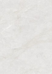 Close-up of a smooth, light-colored marble surface with subtle veining patterns.