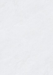 Close-up of a textured white surface with subtle patterns and soft lighting