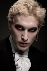 Young man showcases an impressive Halloween costume with striking details