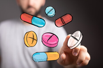 Image of hand interacting with colorful pills,ideal for healthcare, medicine, pharmacy, treatment, wellness, technology.