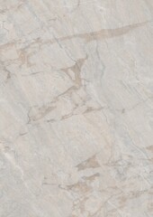 Close-up view of a light-colored marble surface with natural veining patterns