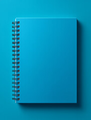 Spiral notebook mockup in marina blue color on a flat surface, showcasing minimalistic design with copy space for creative projects and presentations mockup