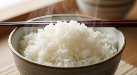 Steaming bowl of rice white rice cooked rice asian cuisine healthy food grain staple with chopsticks