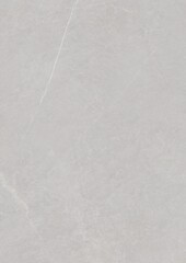 Close-up of a smooth, light gray textured surface with faint linear markings