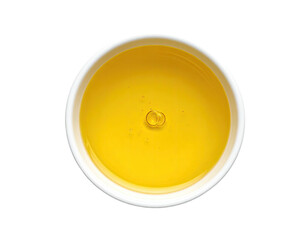 Creamy yellow liquid in small white bowl