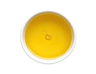 Creamy yellow liquid in small white bowl