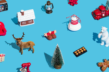 Trendy Christmas pattern made of various Xmas objects on light blue background. Minimal Christmas and New Year concept. Creative festive holiday pattern backdrop. Xmas aesthetic.