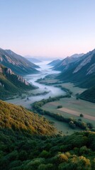 Fototapeta premium Sunrise over Mountain Valley Revealing Serene Landscape with Misty Valley Floor and Verdant Green Foliage