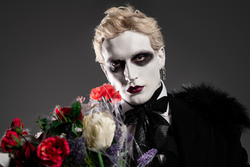 Captivating young man embraces Halloween spirit in a stunning dramatic costume