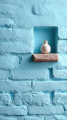 Textured Light Blue Brick Wall with Recessed Niche Holding a Small Vase and Decorative Element