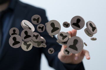 Concept of teamwork and partnership, man reaching out to digital icons symbolizing collaboration in...