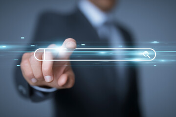 Businessman pressing a search button, highlighting digital access and online exploration for information retrieval and data discovery.