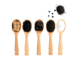 Wooden spoons holding various ingredients, including sugar cubes, dark berries, brown sugar, black peppercorns, and powdered sugar