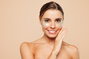 Beautiful nice half naked topless young woman 20s with nude make up wearing patch under eye...