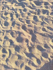 ripples in the sand. Sand texture. Walked sand. 