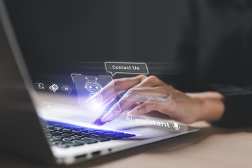 Obraz premium Hand typing on laptop with virtual chatbot and AI assistant interface, representing artificial intelligence technology, digital communication, customer support, and virtual helpdesk services.