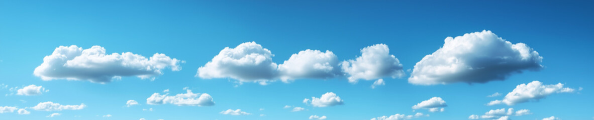 Fototapeta premium Clouds drifting across bright blue sky in panoramic wide horizon, minimalist calm scene.