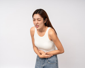 A woman had a stomach ache and gastritis. She put her hand on her stomach and squeezed it to relax and soothe. Unwell unhealthy female menstrual cramps on isolated white background.
