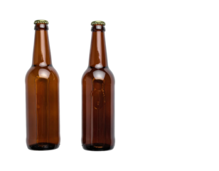 Two amber glass beer bottles, capped, isolated on black