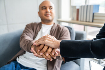 A male mental health patient consults a psychiatrist undergoing therapy and psychological...