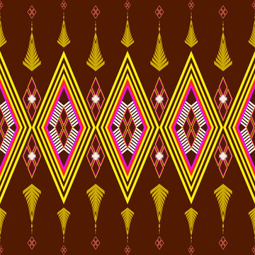 Abstract seamless tribal geometric pattern featuring diamond shapes, bold yellow lines, and pink accents on a brown background. Perfect for textile, wallpaper, wrapping paper, and digital design.