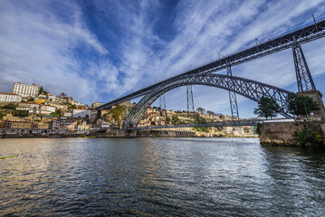 Fototapeta premium Dom Luis I Bridge and Porto city over Douro River seen from Vila Nova de Gaia city, Portugal