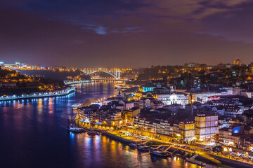 Aerial view on Douro River and Arrabida Bridge on background in Porto, Portugal
