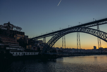 Sunset view with Dom Luis I Bridge connected cities of Porto and Vila Nova de Gaia, Portugal